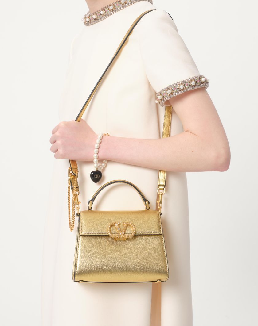 Valentino Handbags Borsa A Mano Mini Valentino Garavani Vsling In Vitello Granato Laminato Con Logo Gioiello per Donna in Antique Brass | Valentino IT Acquista Ora