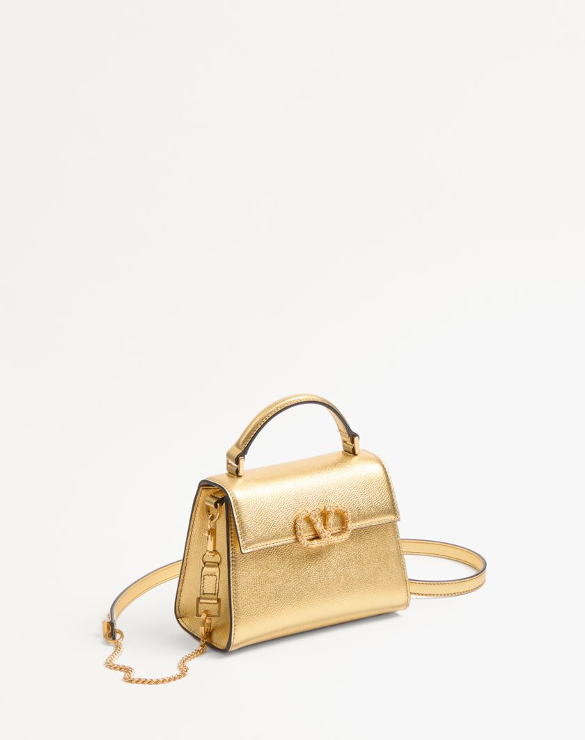Valentino Handbags Borsa A Mano Mini Valentino Garavani Vsling In Vitello Granato Laminato Con Logo Gioiello per Donna in Antique Brass | Valentino IT Acquista Ora
